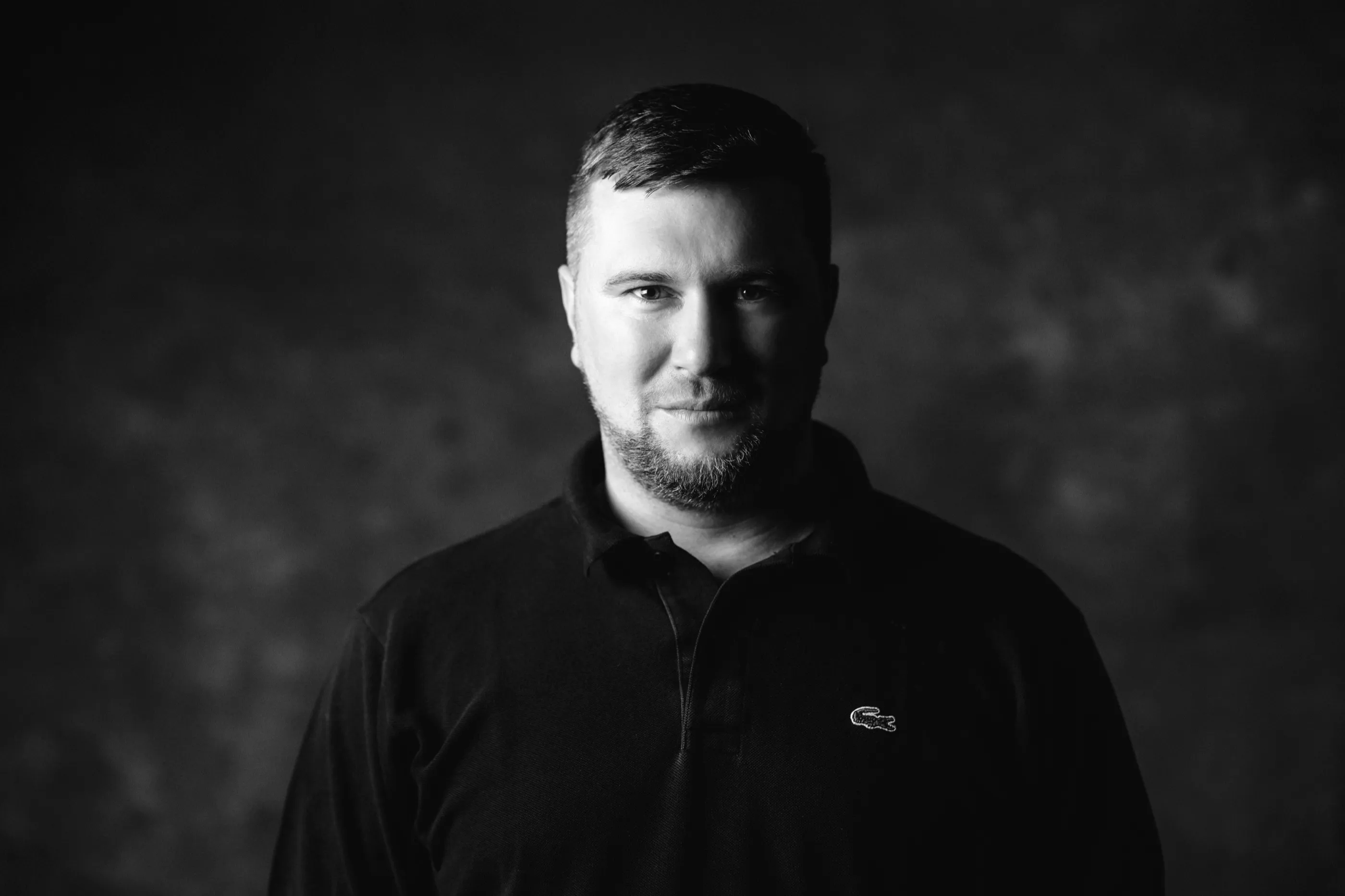 Black and white studio portrait of Ian Kita